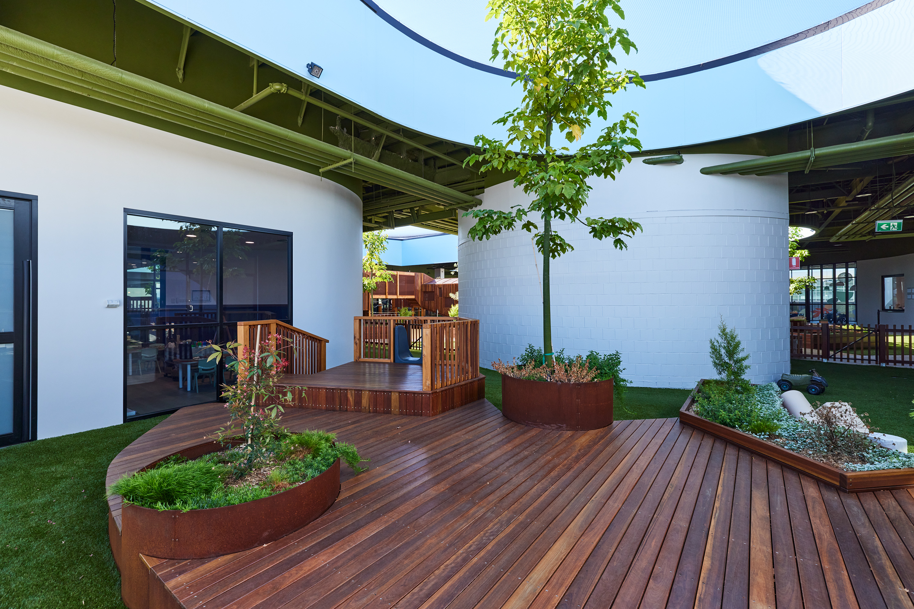 Architectural detail of circular skylight opening above nature play space