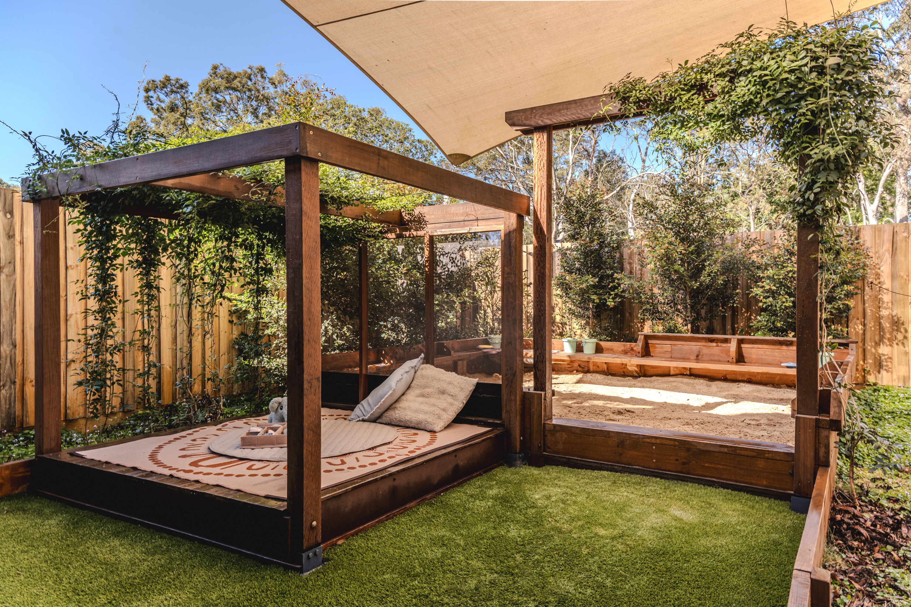 Babies cubby with cushions and sandpit