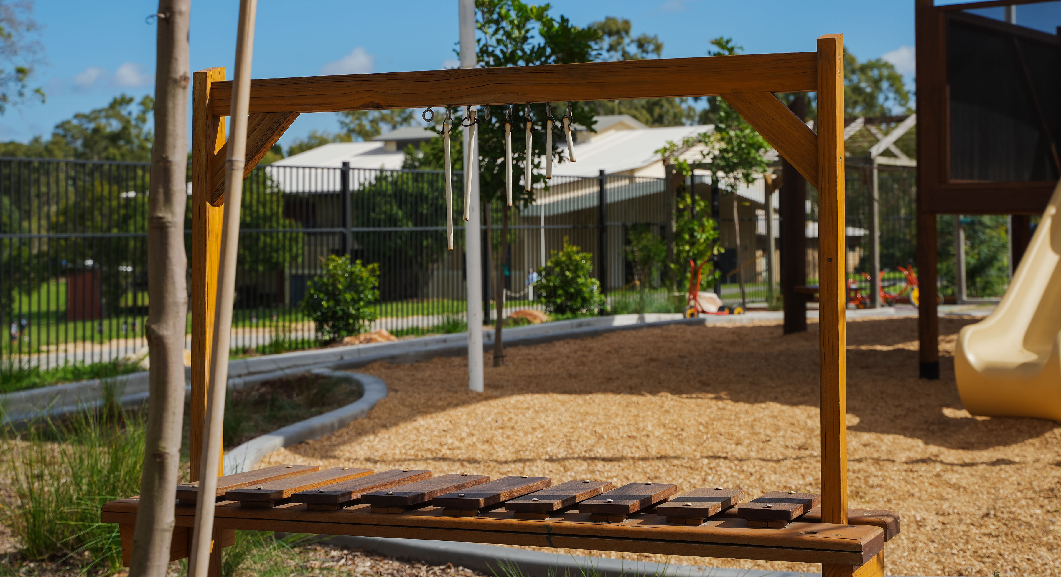 An outdoor musical instrument station for sensory play