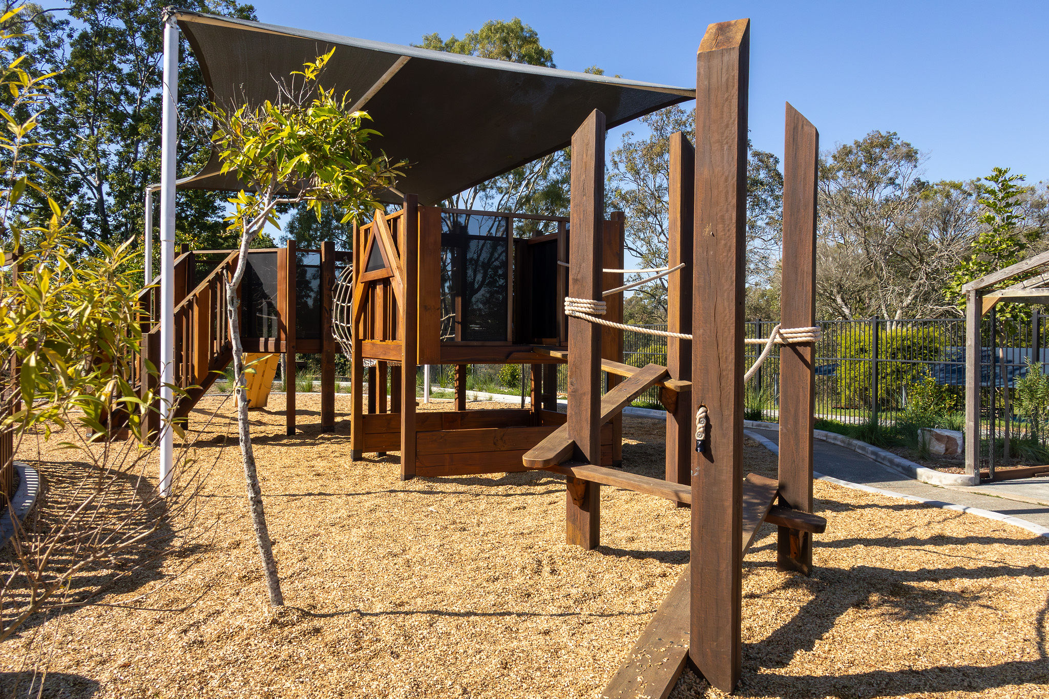 Climbing net and ladder rungs on the play tower