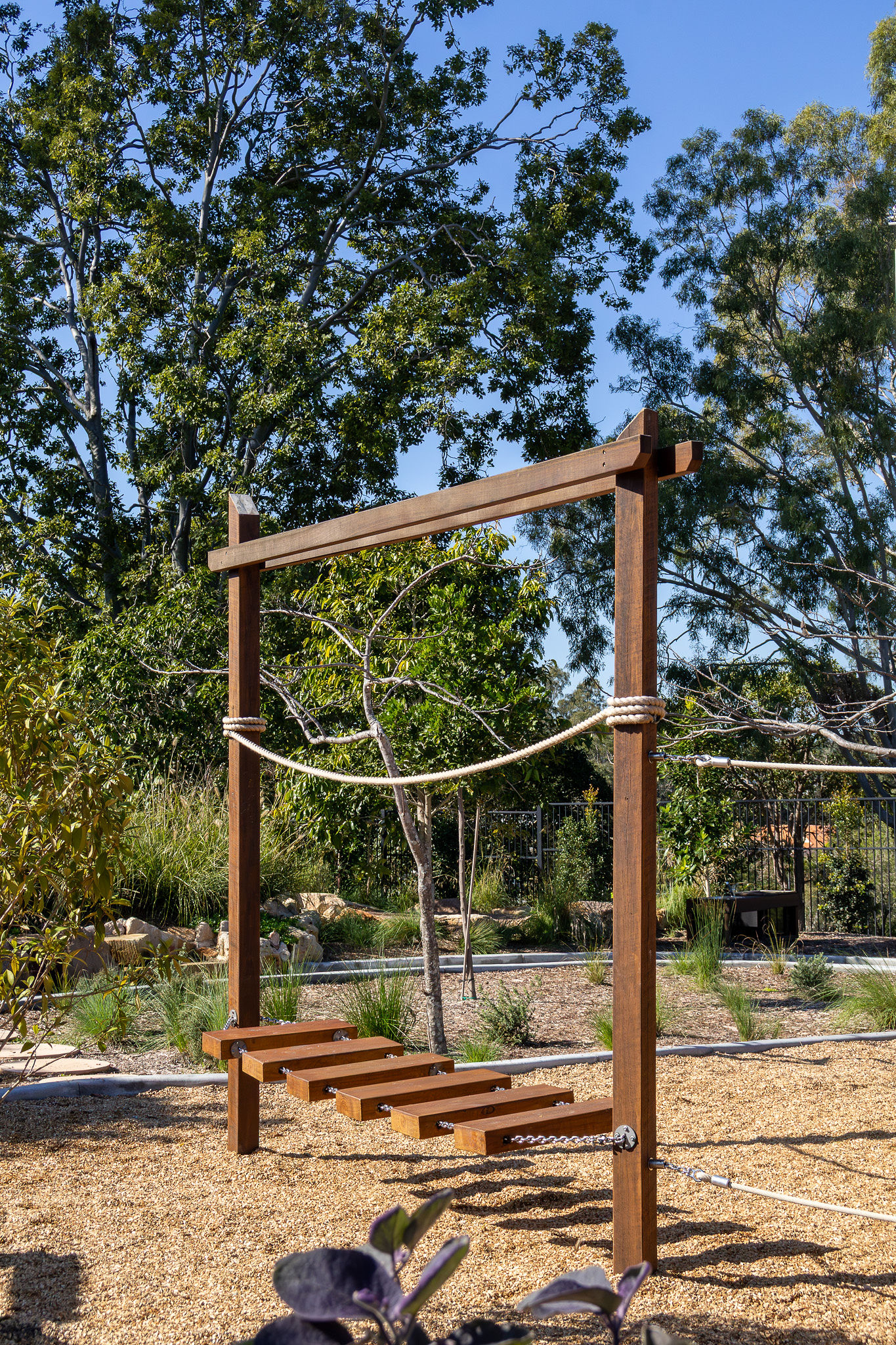 A child crossing the angled stepping bridge