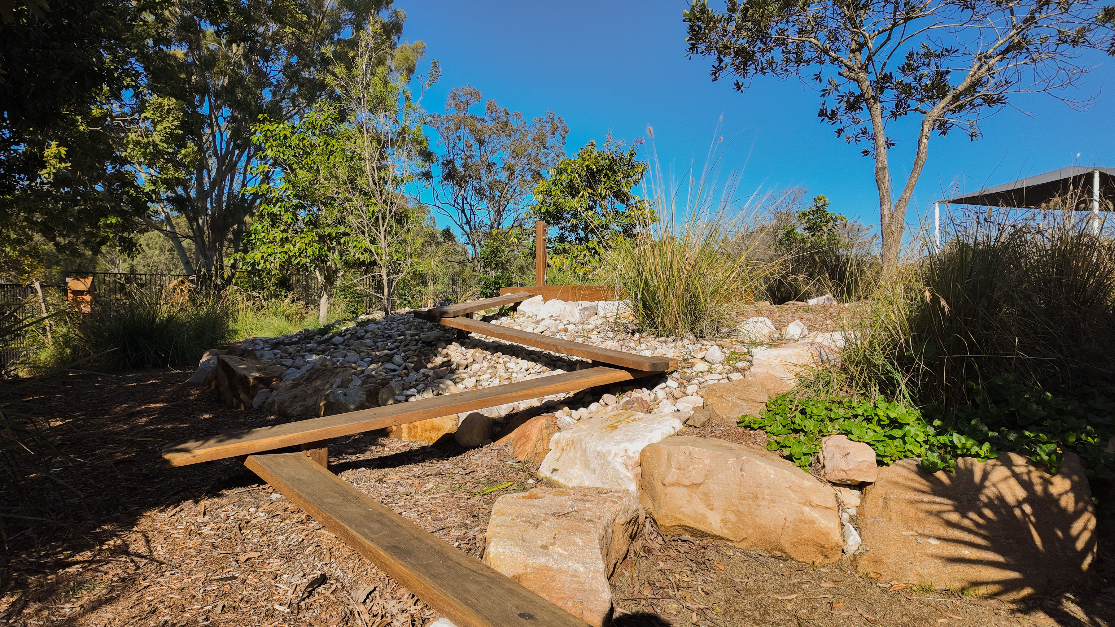 The zigzag balance beam bridge over the rock creek bed