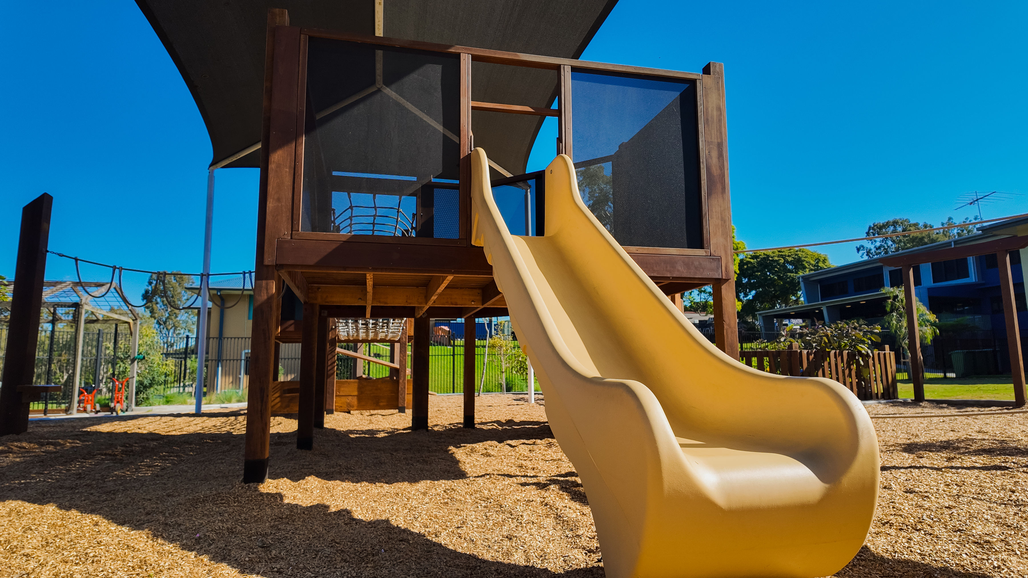 Ground-level view of the play tower and slide