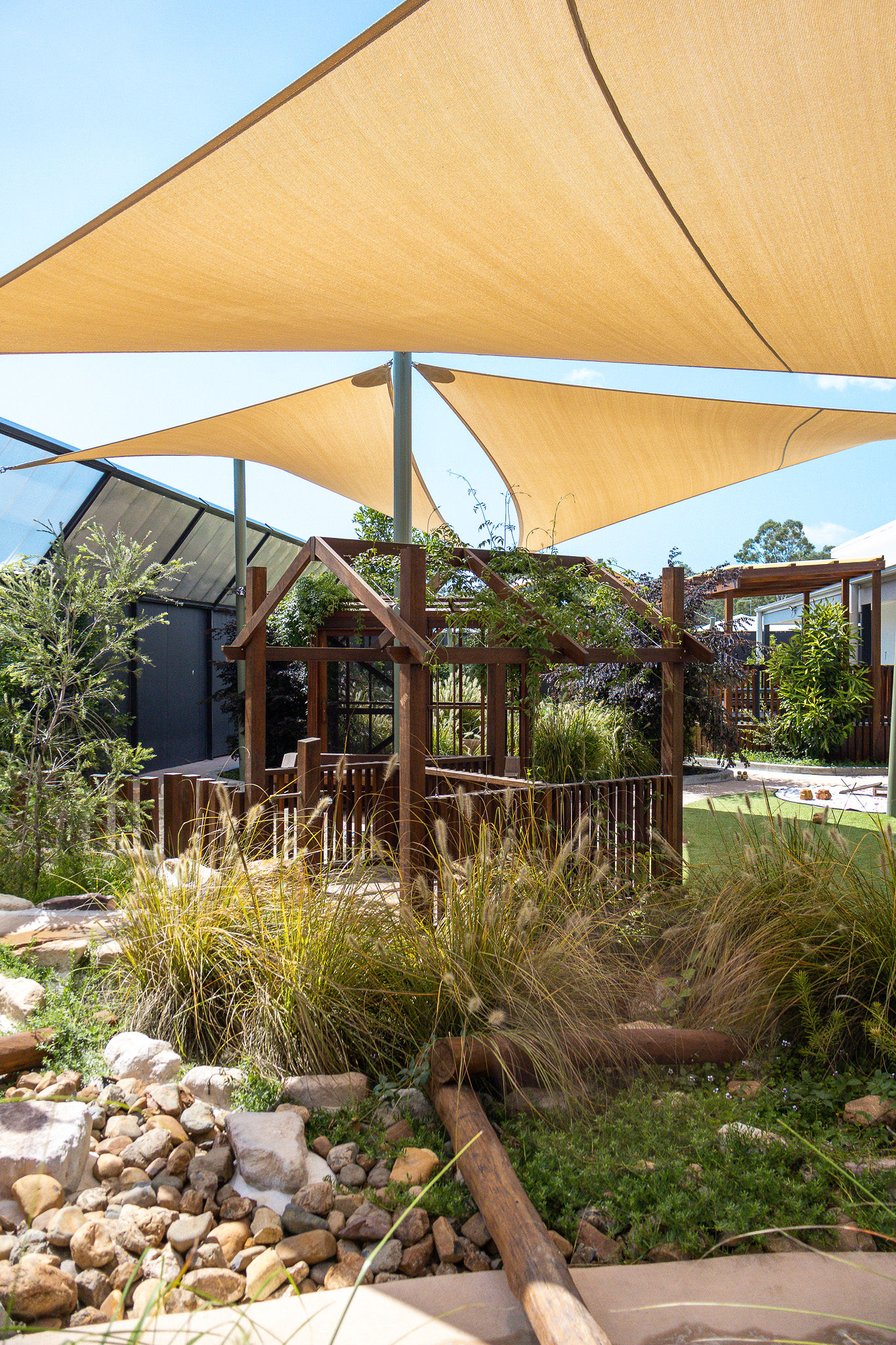 Water play zone with rocks and logs