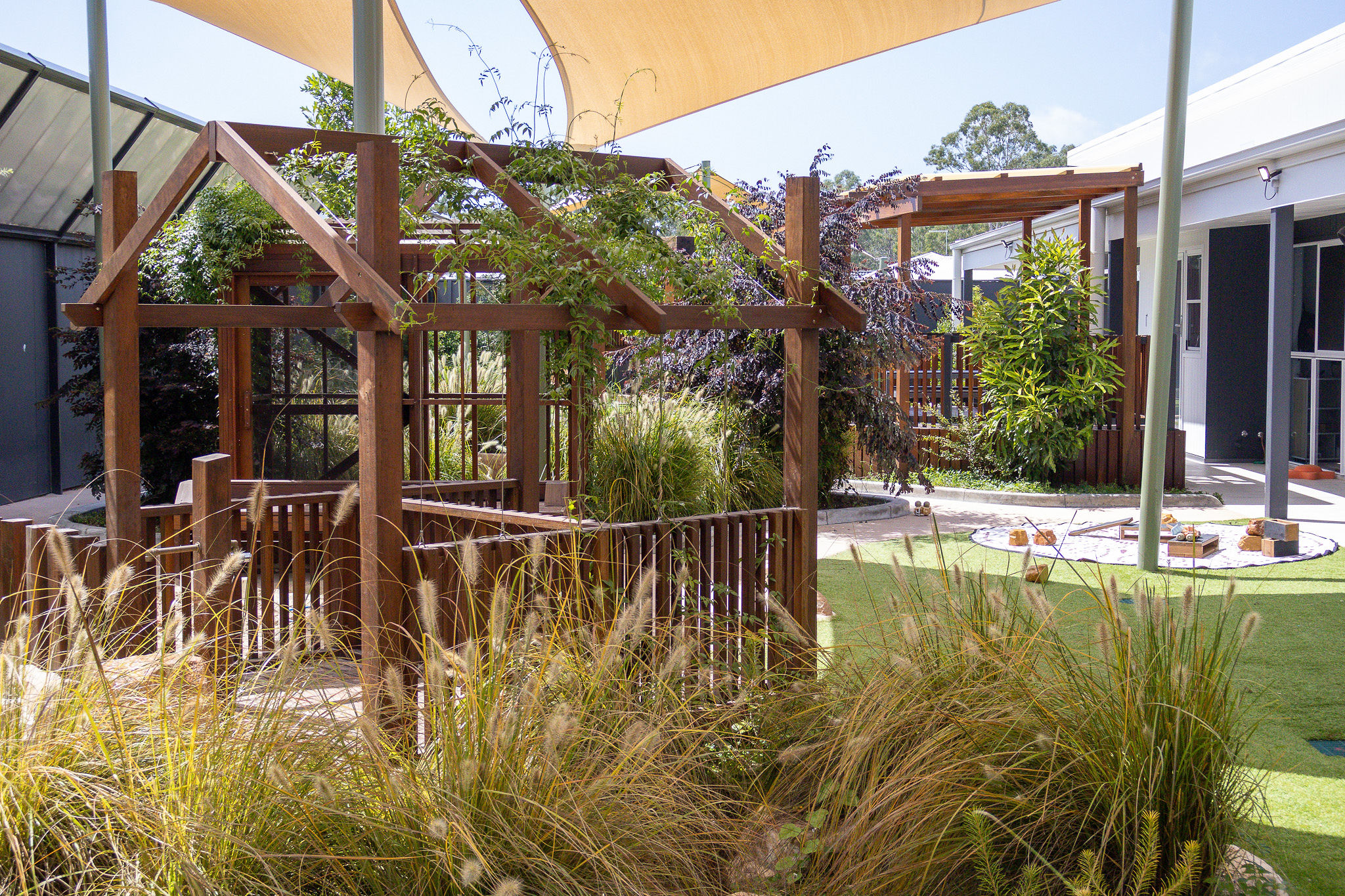 Timber fort structure amongst native grasses