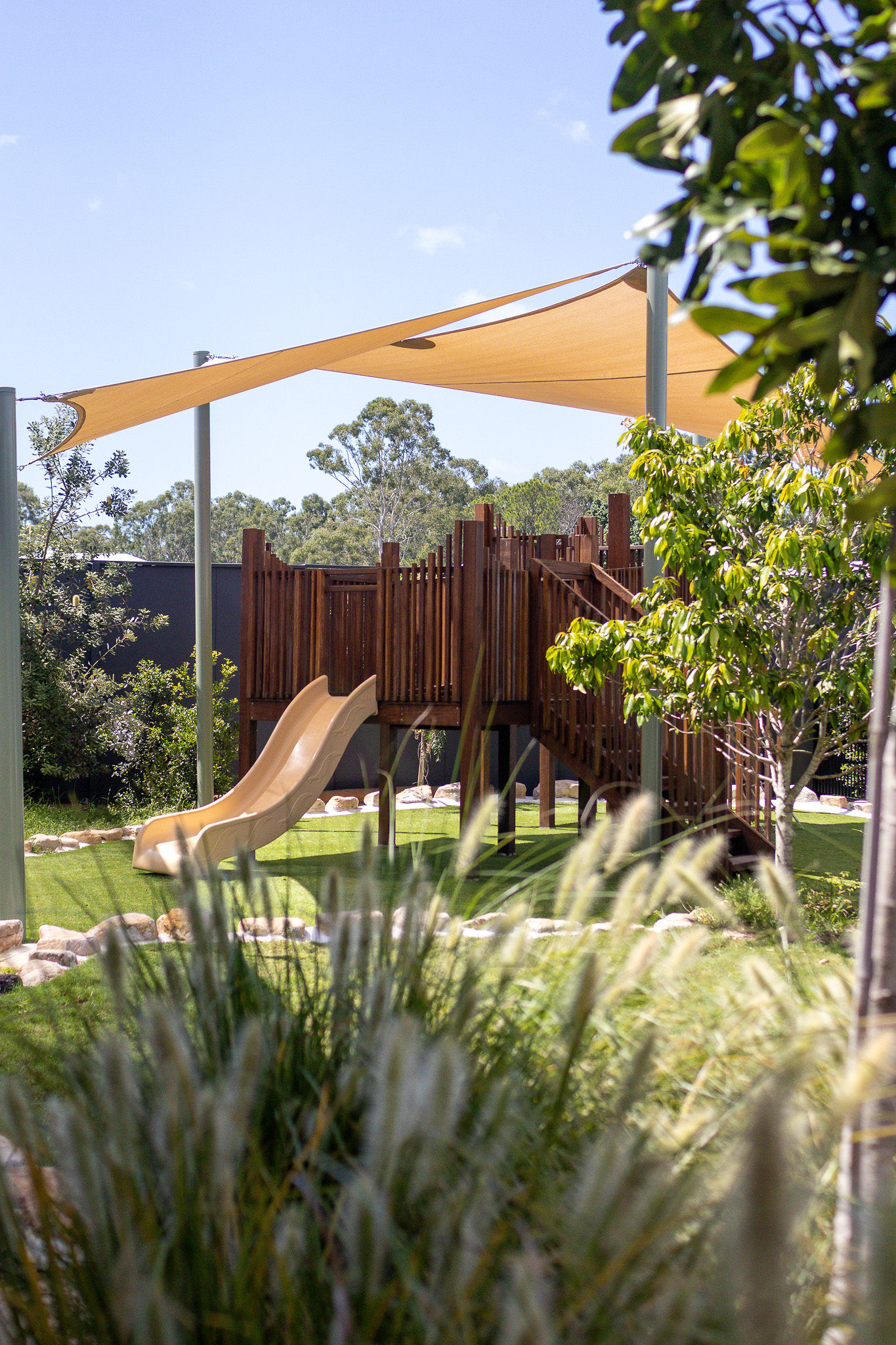 Timber cubby with slide in the babies yard