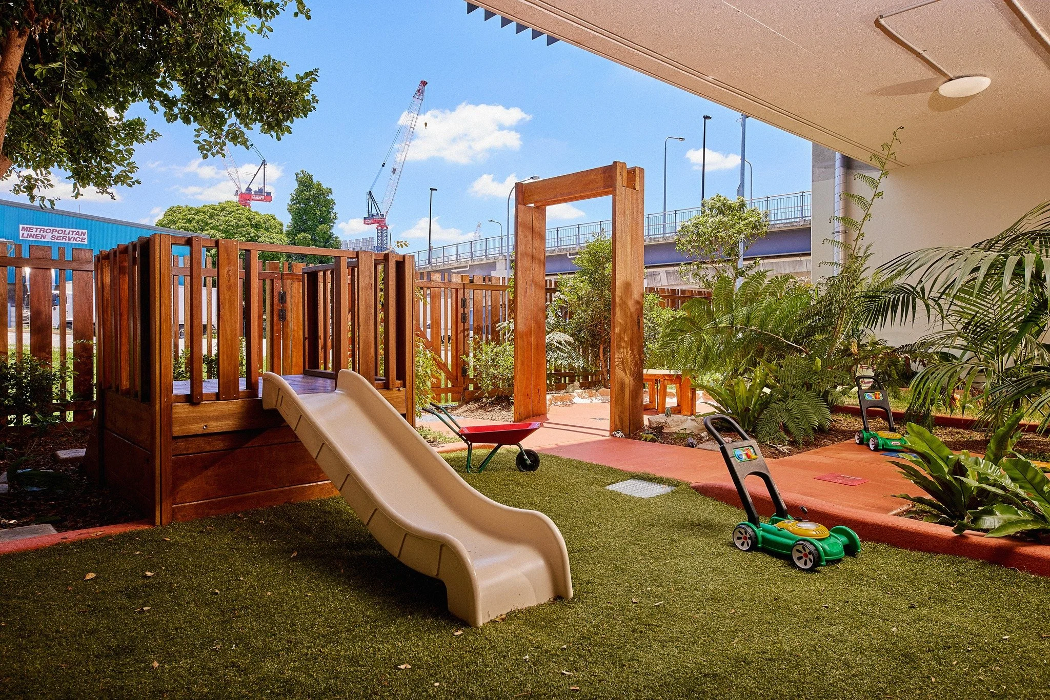 Children exploring a natural outdoor play environment